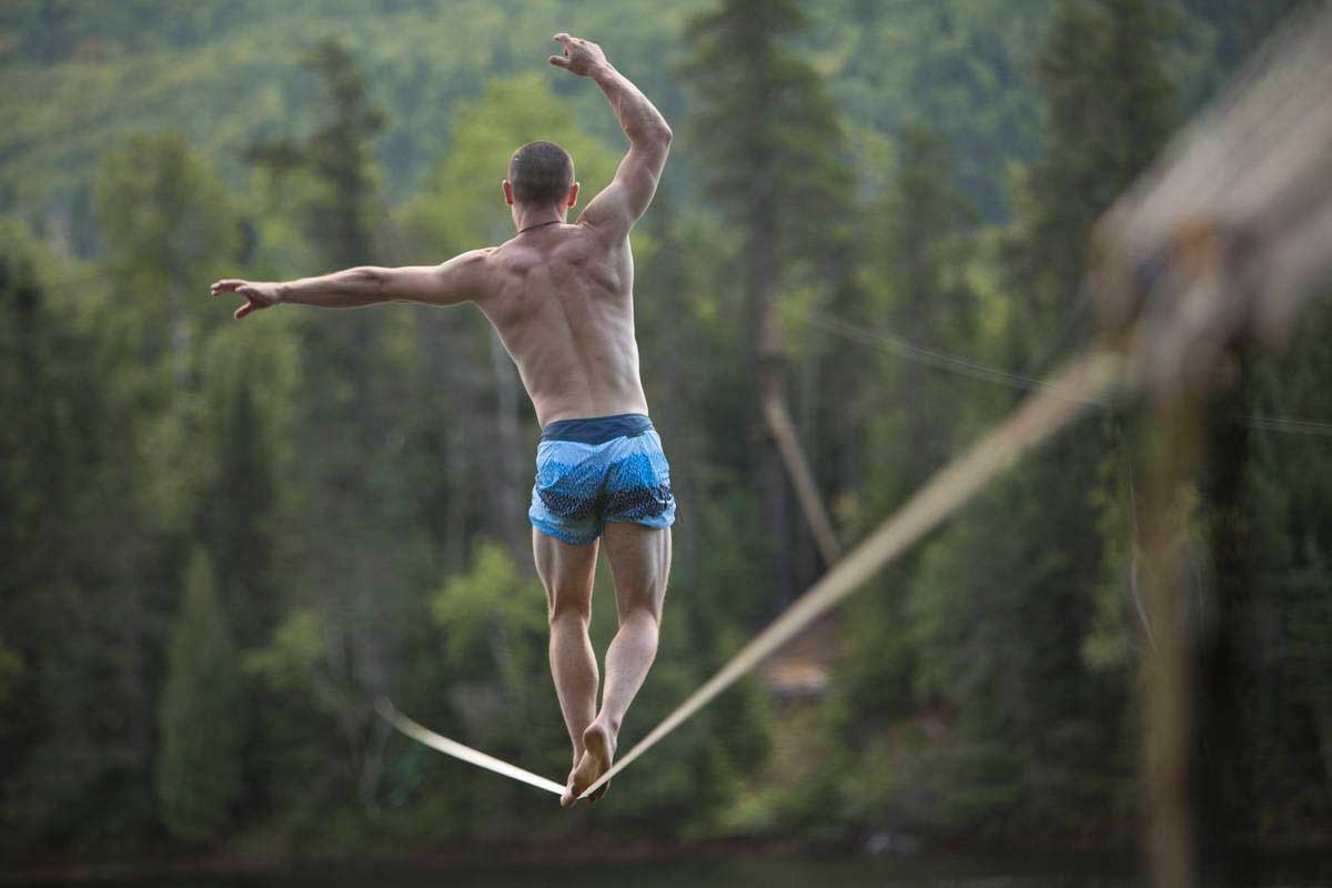 man balancing on tight rope